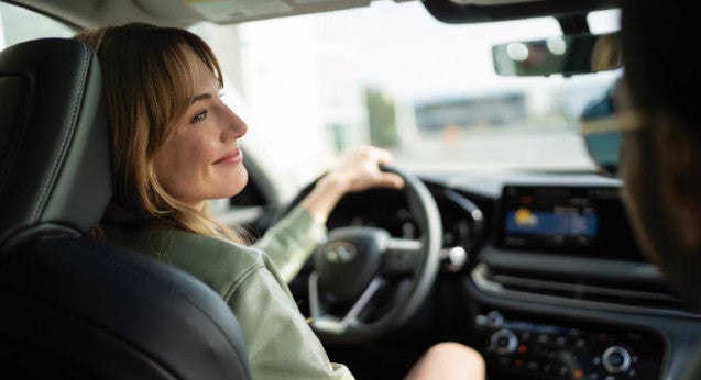 Woman driving INFINITI car