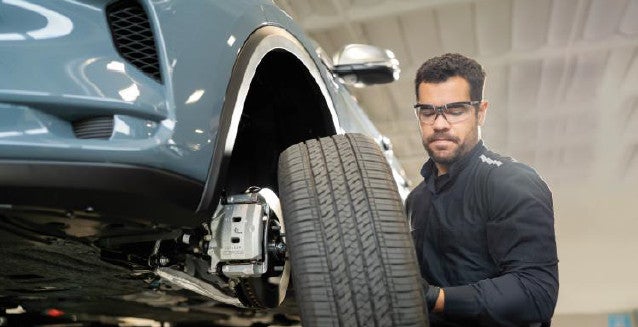 Service expert working on tire maintenance